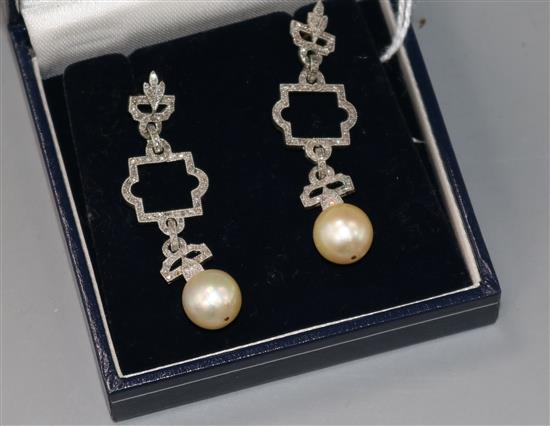 A pair of 1920s/1930s white metal, diamond and cultured pearl set openwork drop earrings, 48mm.